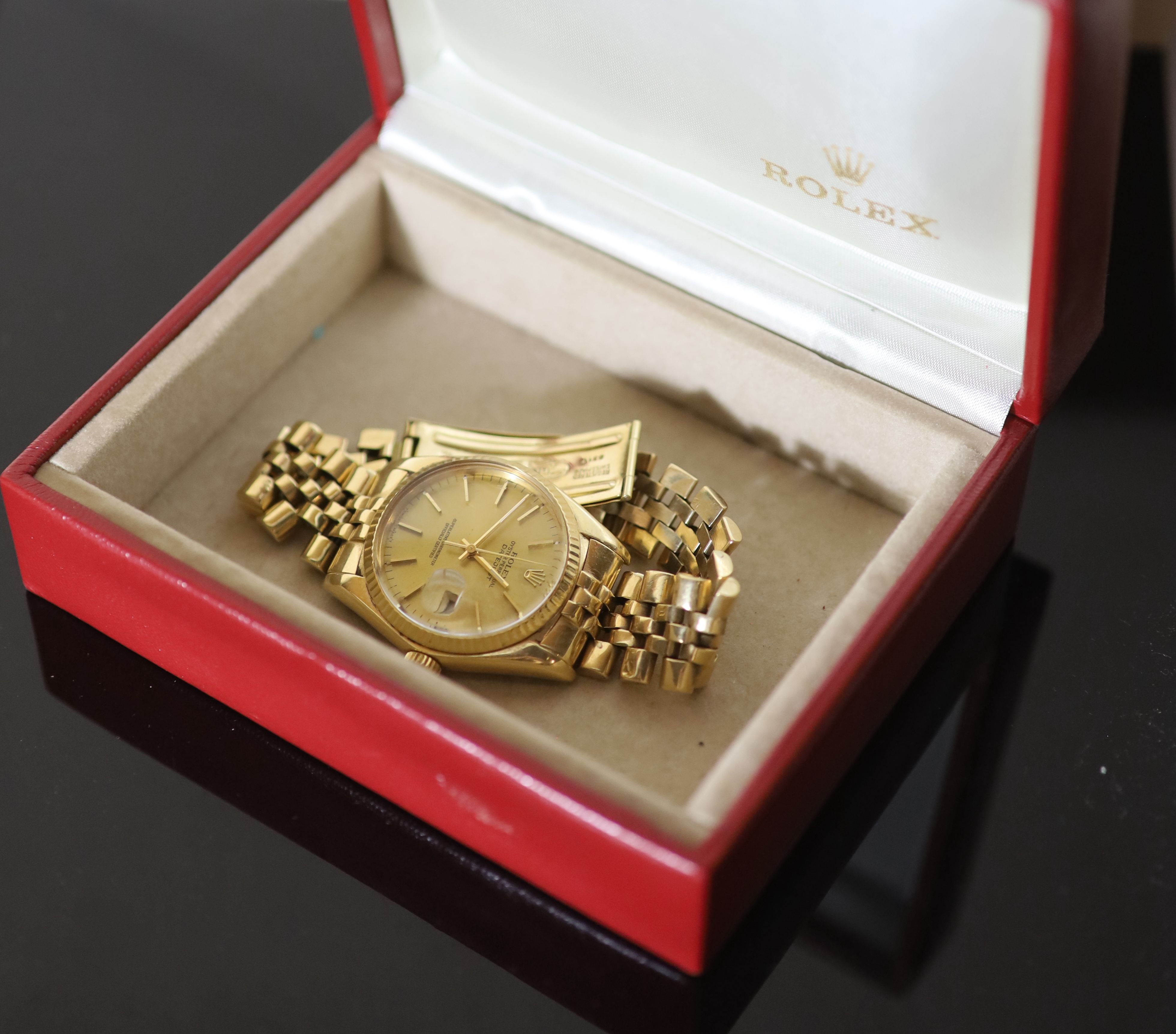 A gentlemans 1990s? 18k gold Rolex Oyster Perpetual Datejust wrist watch, on a 18k gold Rolex bracelet,